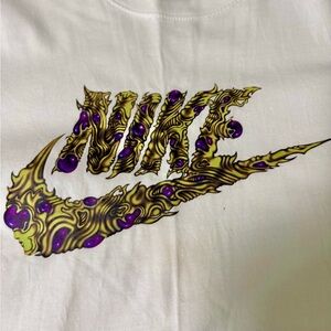 Nike Men’s Graphic Tee with Purple and Gold Design - size M